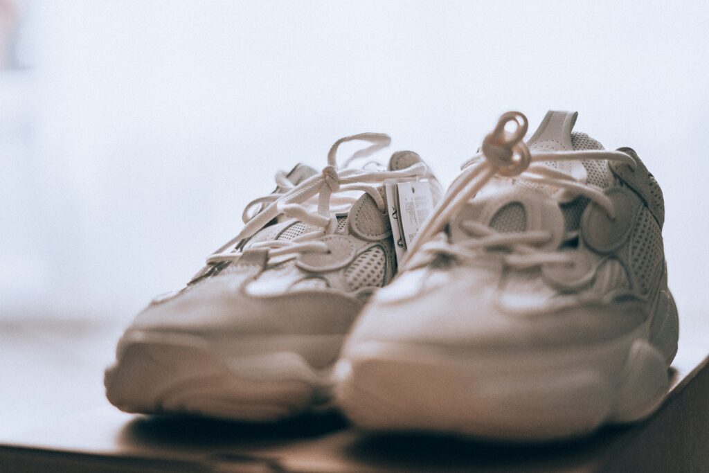 A pair of trainers, representing the choice between pushing through pain and avoiding activity.